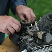 why lawn mower engine popping sound