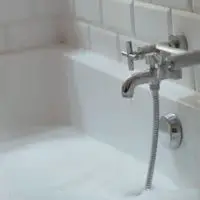bathtub faucet leaking after water turned off (solved)