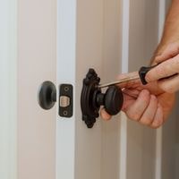 how to unlock a door knob with a hole on the side