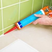 how to remove silicone caulk from fiberglass shower stall