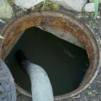 why water coming out of septic tank lid