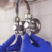 hot and cold water lines under the sink