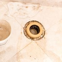 how to fix a broken toilet flange in concrete 2022