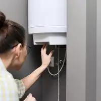 reset button on electric water heater doesn't click