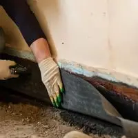 waterproofing the walls and joints of the basement