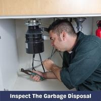 inspect the garbage disposal
