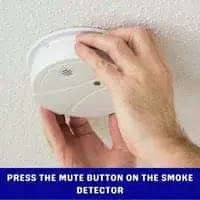 press the mute button on the smoke detector 2
